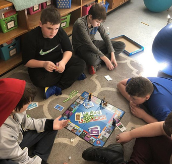 students playing Monopoly