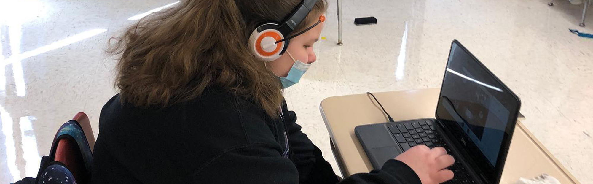 student sitting at her desk